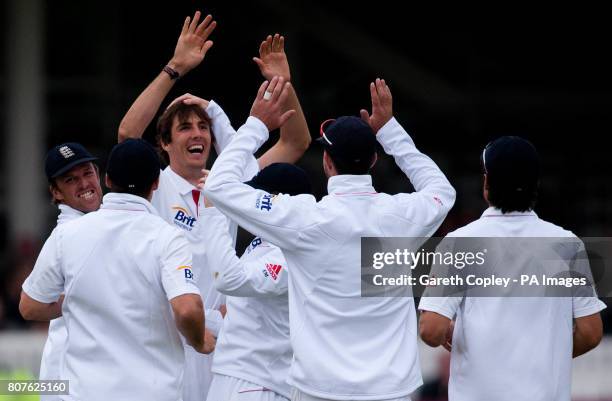 England's Steven Finn celebrates bowling Bangladesh's Mushfiqur Rahim during the first nPower Test Match at Lords, London.