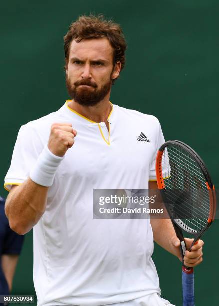 Ernests Gulbis of Latvia celebrates during the Gentlemen's Singles first round match against Victor Estrella Burgos of The Dominican Republic on day...