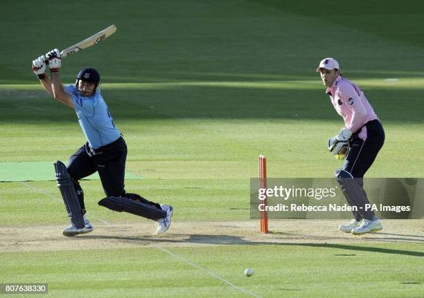 Middlesex Panthers wicketkeeper Adam Gilchrist watches Sussex Sharks Michael Yardy hit the ball for 4 runs during the Friends Provident T20 match at...