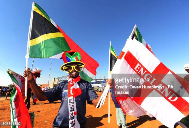 Football fans gather outside the stadium, prior to the training match at Moruleng Stadium, Moruleng, South Africa.