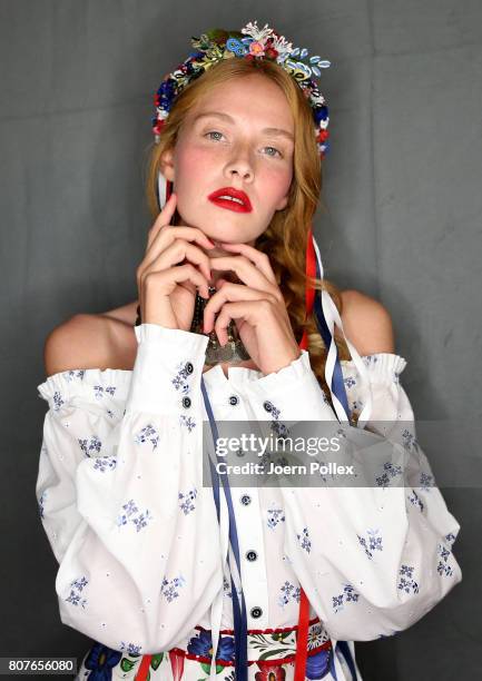 Model Sandra Hunke is seen backstage ahead of the Lena Hoschek show during the Mercedes-Benz Fashion Week Berlin Spring/Summer 2018 at Kaufhaus...