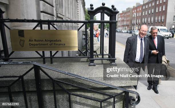 Former International Monetary Fund experts Klaus Regling and Max Watson arrive at the Department of Finance after appearing before the Joint...