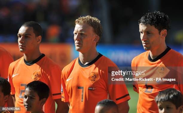 Holland's Gregory Van Der Wiel, Dirk Kuyt and Mark Van Bommel line up before the game
