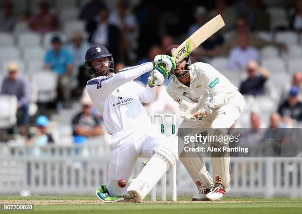 Ian Holland of Hampshire in action during day two of the Specsavers County Championship Division One match between Surrey and Hampshire at The Kia...