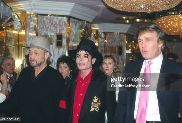 Businessman Donald Trump and Pop Star Michael Jackson and unknown at the opening of Trump Taj Mahal Casino Hotel in Atlantic City, New Jersey April 2...