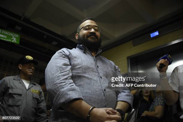 Javier Duarte, former governor of the Mexican state of Veracruz, accused of graft and involvement in organized crime, is escorted by police officers...