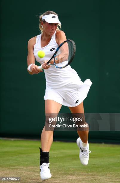 Denisa Allertova of the Czech Republic plays a backhand during the Ladies Singles first round match against Risa Ozaki of Japan on day two of the...
