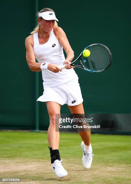 Denisa Allertova of the Czech Republic plays a backhand during the Ladies Singles first round match against Risa Ozaki of Japan on day two of the...