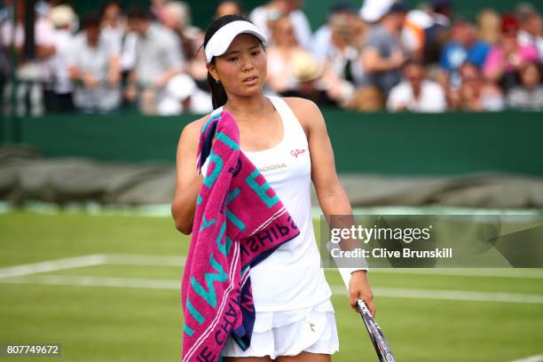 Risa Ozaki of Japan reacts during the Ladies Singles first round match against Denisa Allertova of the Czech Republic on day two of the Wimbledon...