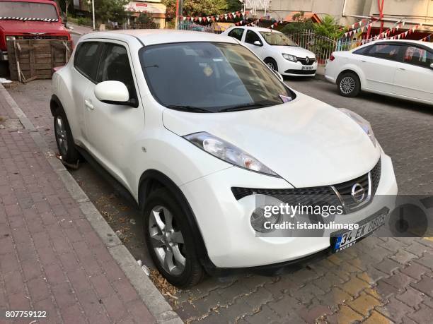 nissan qashqai parking in the street - nissan qashqai stock pictures, royalty-free photos & images