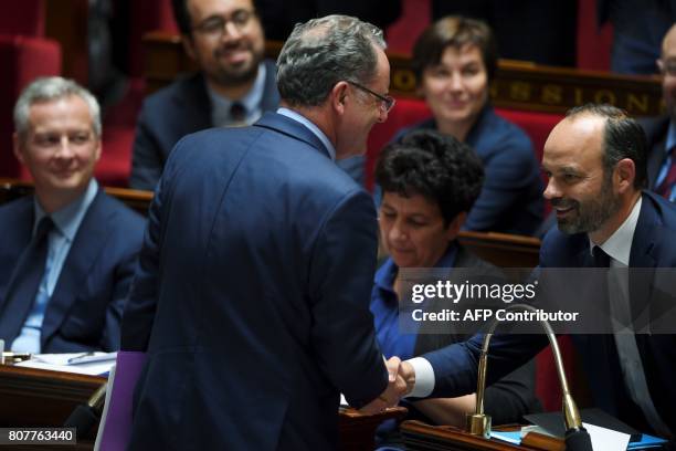 La Republique En Marche party's group president at the French national assembly, Richard Ferrand shakes hand with French Prime Minister, Edouard...