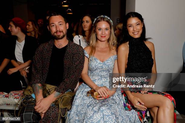 Designer Marcel Ostertag, Pauline Knof and Rebecca Mir attend the Lena Hoschek show during the Mercedes-Benz Fashion Week Berlin Spring/Summer 2018...