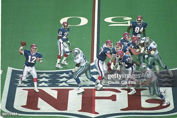 Quarterback Jim Kelly of the Buffalo Bills sets up to pass against the Dallas Cowboys in Super Bowl XXVIII at the Georgia Dome on January 30, 1994 in...