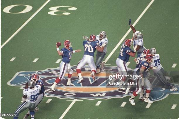 Quarterback Jim Kelly of the Buffalo Bills sets up to pass against the Dallas Cowboys in Super Bowl XXVIII at the Georgia Dome on January 30, 1994 in...