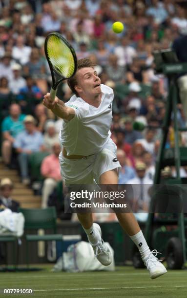 Alexander Bublik of Kazakstan in action against Andy Murray of Great Britain during the Wimbledon Lawn Tennis Championships at the All England Lawn...