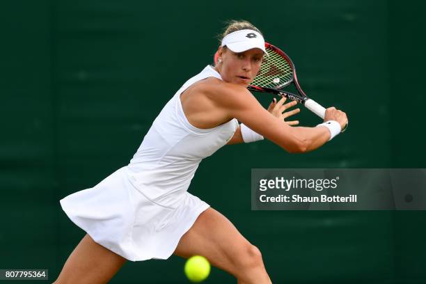 Yanina Wickmayer of Belgium plays a backhand during the Ladies Singles first round match against Kateryna Bondarenko of Ukraine on day two of the...