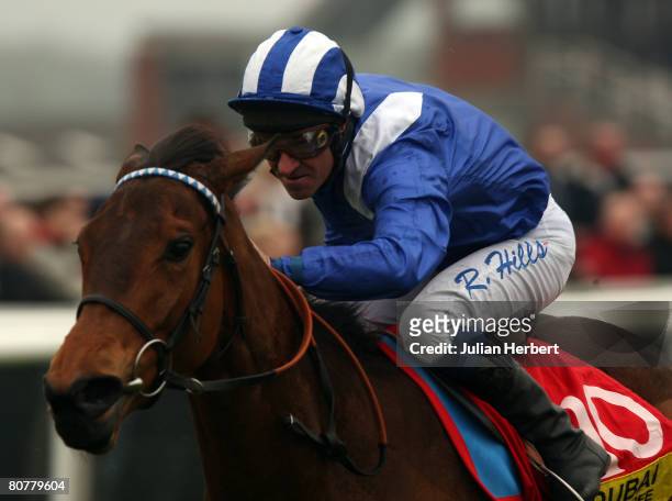 Richard Hills and Mutabara lead the field home to land The Dubai Duty Free Stakes Race run at Newbury Racecourse on April 19 in Newbury, England.