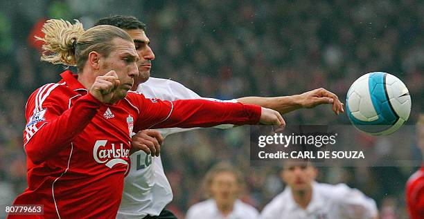 Liverpool's Ukranian forward Andriy Voronin and Fulham's Canadian player Paul Stalteri vie during their Premiership match at home to Fulham at Craven...