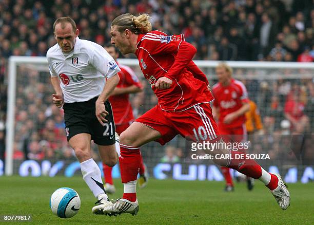 Liverpool's Ukranian forward Andriy Voronin vies with Fulham's Danny Murphy during their Premiership match at home to Fulham at Craven Cottage...