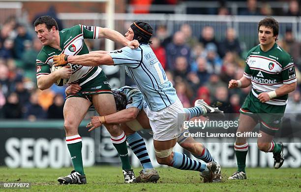 Aaron Mauger of Leicester Tigers is tackled by Dan Ward-Smith of Bristol during the Guinness Premiership match between Leicester Tigers and Bristol...