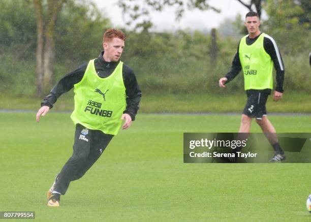 Jack Colback passes the ball during the Newcastle United Training Session at the Newcastle United Training Centre on July 4, 2017 in Newcastle upon...