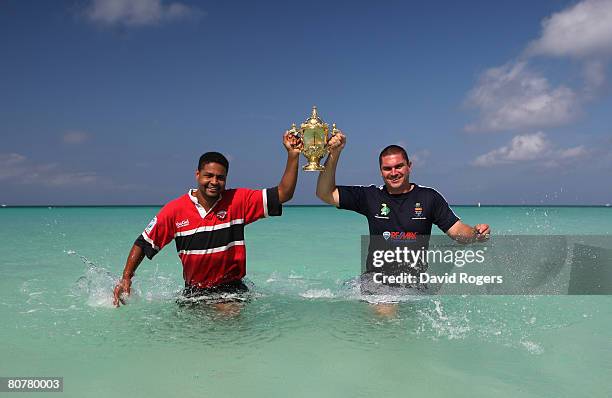 Captains John Wagner of the Cayman Islands and Adam Frederick, of Trinidad and Tobago, pose with the World Cup ahead of tomorrow's IRB Rugby World...