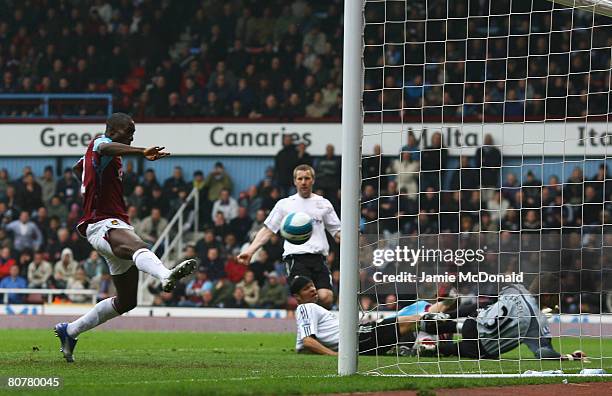 Carlton Cole of West Ham United scores his team's second goal during the Barclays Premier League match between West Ham United and Derby County at...