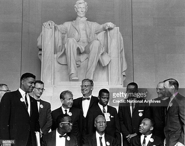 Rev. Martin Luther King and other civil rights leaders gather before a rally at the Lincoln Memorial August 28, 1963 in Washington. Standing from...
