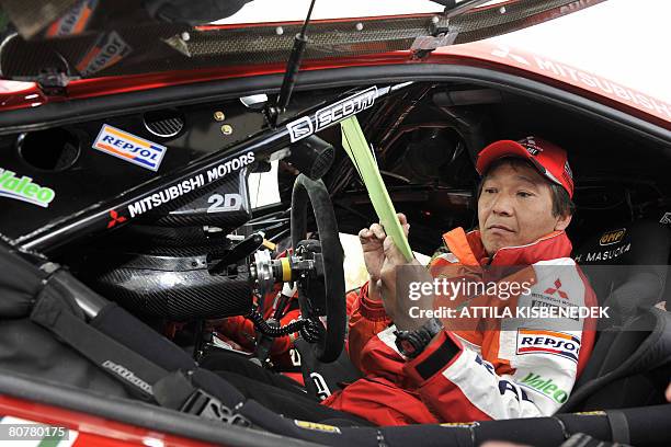 Japanese driver Masuoka Hiroshi of Repsol Mitsubishi Ralliart team arrives with his car at the Heroes square in downtown Budapest on April 19, 2008...