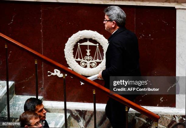 La France Insoumise leftist party's parliamentary group president, Jean-Luc Melenchon walks to the tribune to deliver a speech following the French...