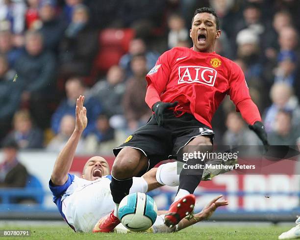 Nani of Manchester United clashes with Steven Reid of Blackburn Rovers during the Barclays FA Premier League match between Blackburn Rovers and...