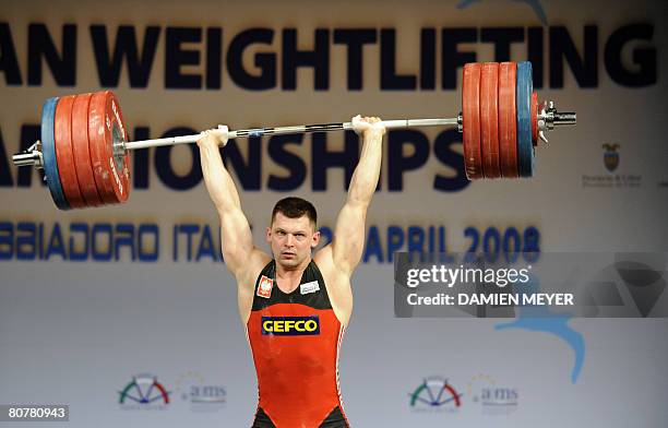 Gold medalist Poland's Szymon Kolecki competes in the men's 94 kg category during the 2008 European weightlifting championships in Lignano Sabbiadoro...