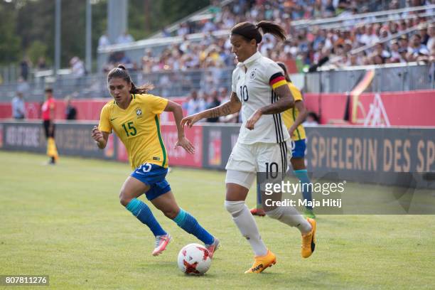 Dzsenifer Marozsan of Germany and Leticia Santos of Brazil battle for the ball during the Women's International Friendly match between Germany and...