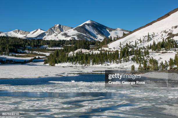 Frozen ice and snow cover Tioga Lake near Tioga Pass on June 28 near Lee Vining, California. Following a five-year drought, a record winter and...