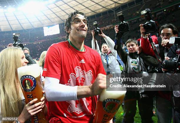 Luca Toni of Bayern Munichenjoys a glas of beer after winning the German Cup Final against Borussia Dortmund at the Olympic stadium on April 19, 2008...