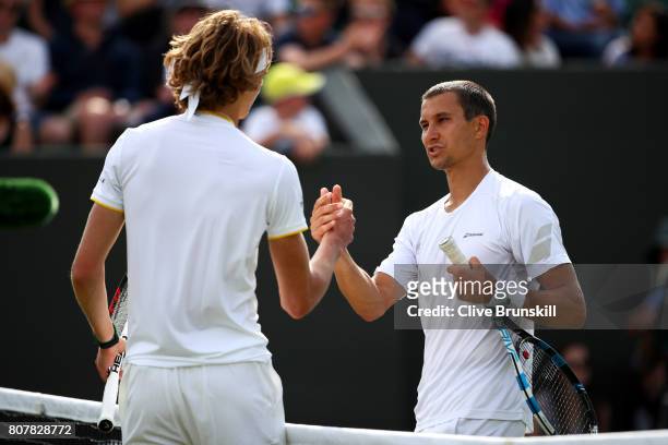Alexander Zverev of Germany and Evgeny Donskoy of Russia shake hands after their Gentlemen's Singles first round match on day two of the Wimbledon...