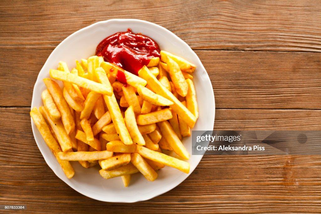 Directly above of french fries with ketchup