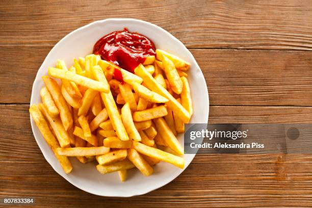 directly above of french fries with ketchup - chips stock pictures, royalty-free photos & images