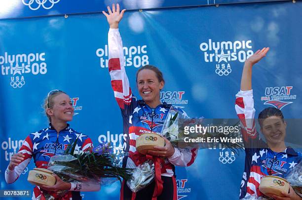 Sarah Haskins, left, Julie Swail Ertel, and Sarah Goff celebrate on the podium after winning the U.S. Olympic Team Trials for Triathlon on April 19,...