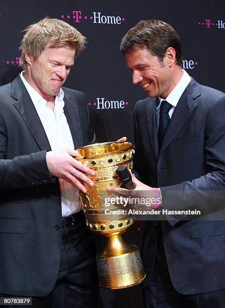 Oliver Kahn of Bayern Munich, holds the DFB-Trophy with Rene Obermann, CEO of Deutsche Telekom during the Bayern Munich champions party after the DFB...