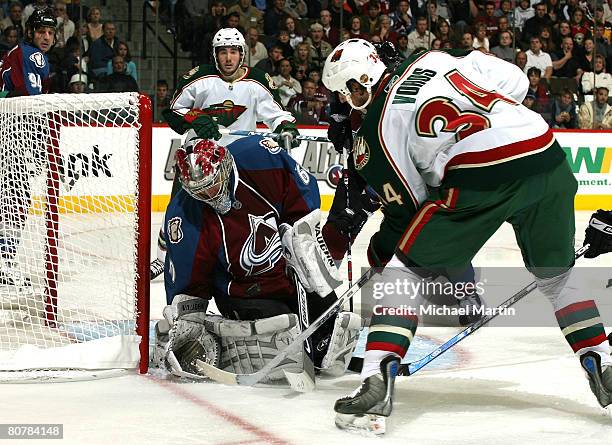 Aaron Voros of the Minnesota Wild shoots against Goaltender Jose Theodore of the Colorado Avalanche during game six of the Western Conference...