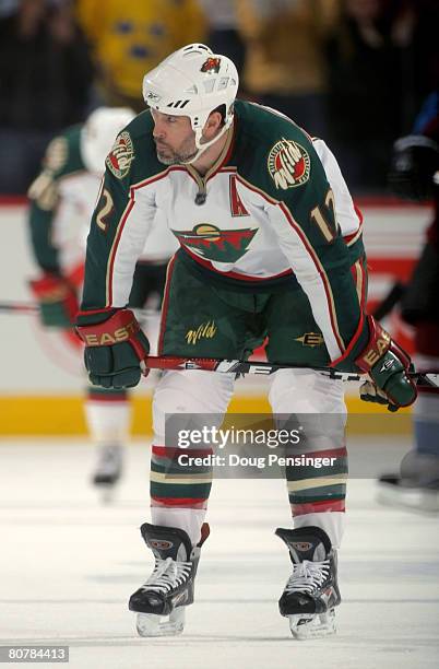 Brian Rolston of the Minnesota Wild skates to the bench for a timeout in the final minute against the Colorado Avalanche in the second period during...