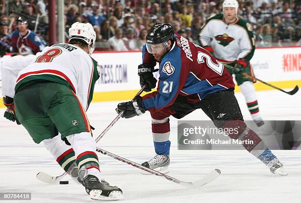 Peter Forsberg of the Colorado Avalanche skates against Brent Burns of the Minnesota Wild during game six of the Western Conference quarterfinals at...