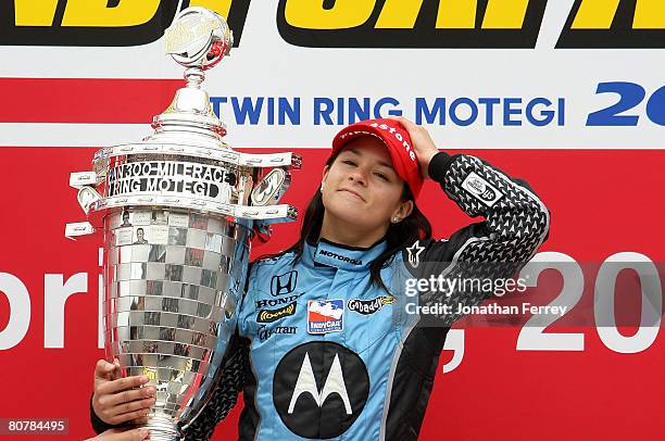 Danica Patrick driver of the Motorola Andretti Green Racing Honda Dallara poses with the trophy after winning the IndyCar Series Bridgestone Indy...