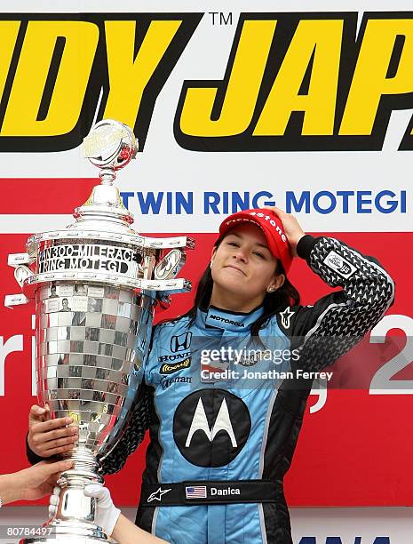 Danica Patrick driver of the Motorola Andretti Green Racing Honda Dallara poses with the trophy after winning the IndyCar Series Bridgestone Indy...