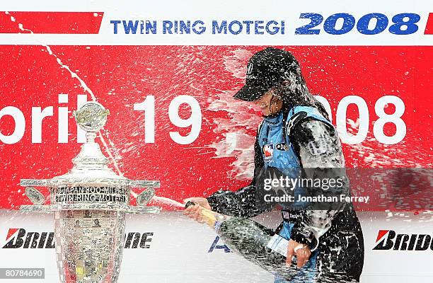 Danica Patrick driver of the Motorola Andretti Green Racing Honda Dallara sprays champagne after winning the IndyCar Series Bridgestone Indy Japan...