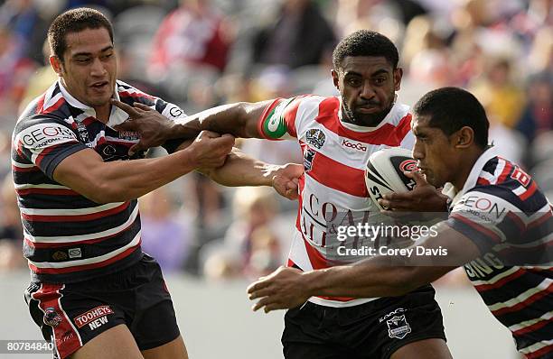 Wes Naiqama of the Knights is tackled during the round six NRL match between the Sydney Roosters and the Newcastle Knights at Bluetongue Stadium on...