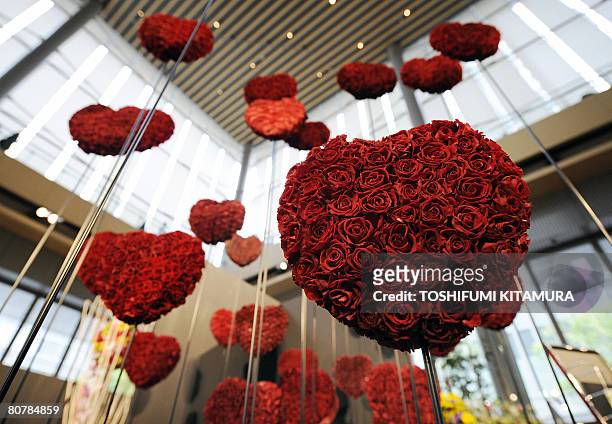 The flower artwork titled "Tsunagaru Kokoro" or "Connecting Heart" is displayed during the Flower Weeks 2008 event at the Marunouchi shopping...