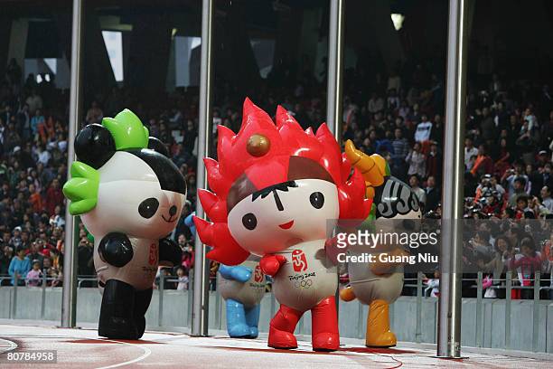 Mascots for the 2008 Beijing Olympic Games display in the "Good Luck Beijing" 2008 Marathon Competition at the National Stadium, or the "Bird's...