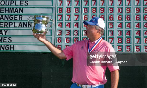 Kenny Perry poses with the Francis D. Ouimet Memorial Trophy at the 18th green after the final round of the 2017 US Senior Open Championship at Salem...
